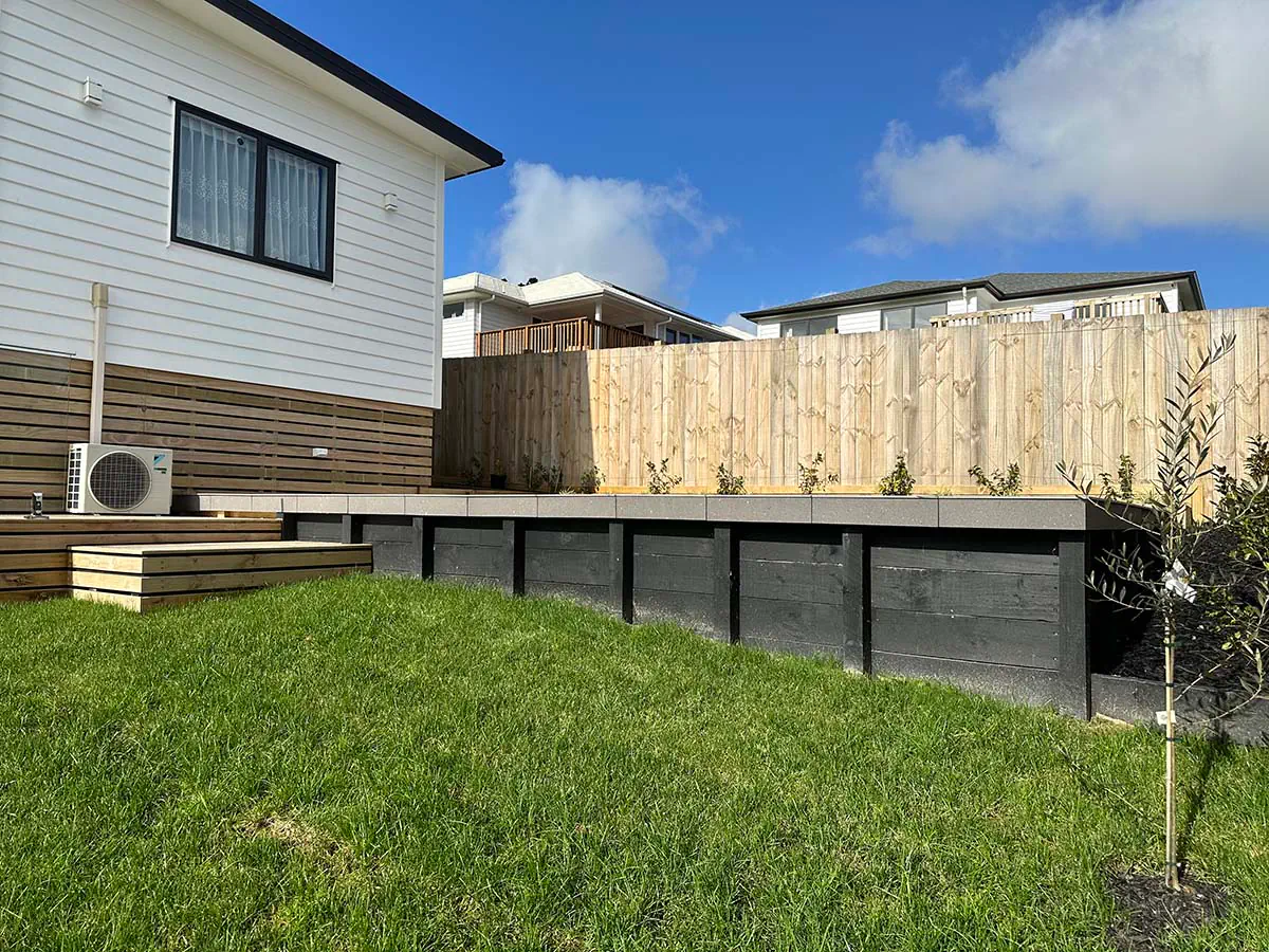 Timber deck with steps leading to a garden.